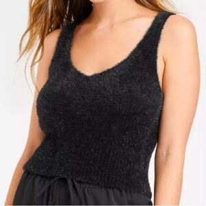 a new day size M, black fuzzy tank with metallic. Like new! Vneck front.